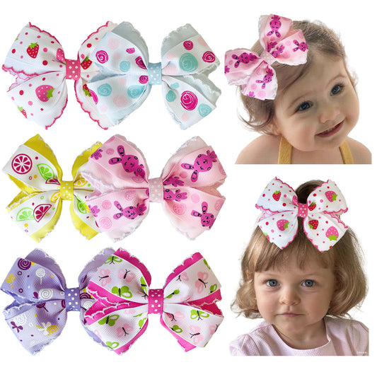 Assorted printed bow hair clips with children wearing the bows