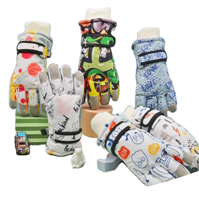 Assorted printed kids winter gloves standing and lying together