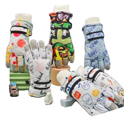 Assorted printed kids winter gloves standing and lying together