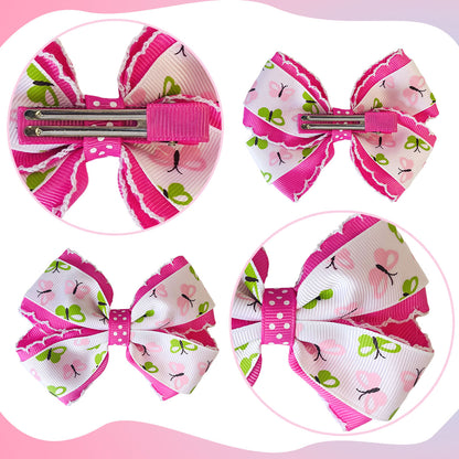 Back view of four pink printed bow hair clips showing metal fasteners