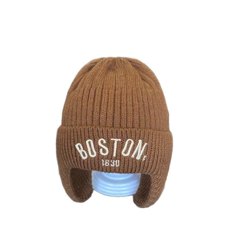 Brown ribbed ear-flap beanie with front label