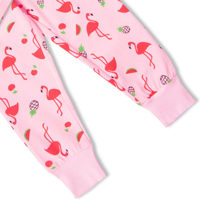 Close-up of pink pajama fabric with flamingo print