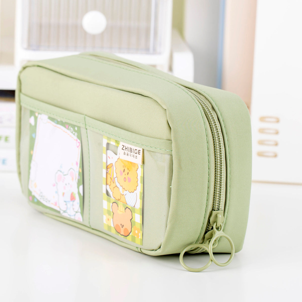 Closed green pencil case with front display pockets