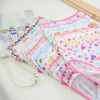 Girls underwear laid flat with pink trim and assorted prints