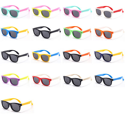 Kids sunglasses arranged in a grid of assorted frame and arm colors