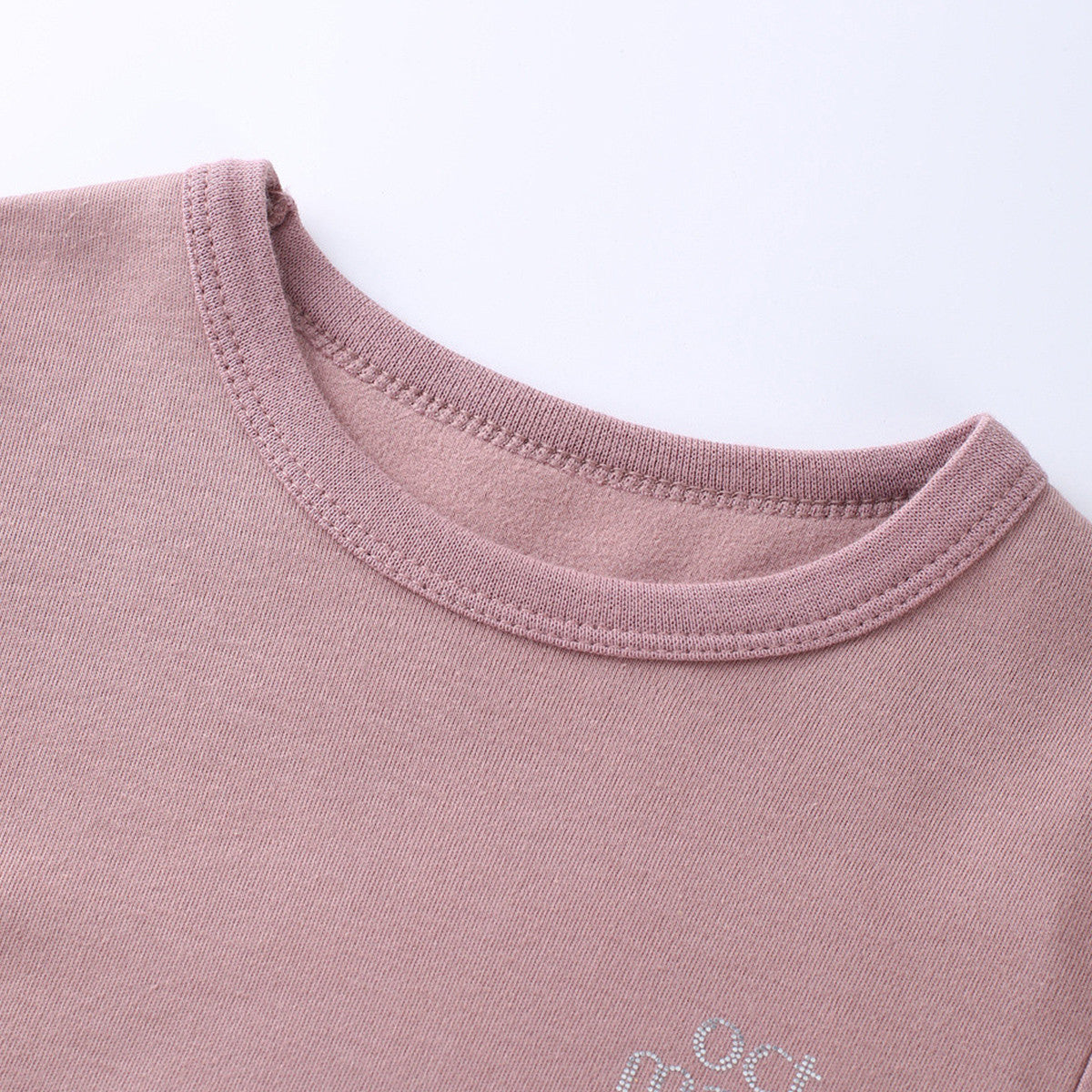 Pink kids base layer neckline and stitching close-up