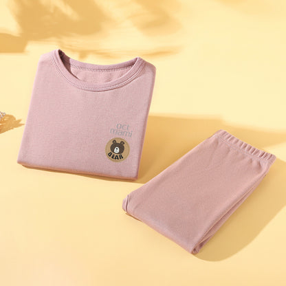 Pink kids long-sleeve base layer top and pants folded together