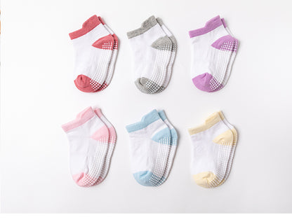 Six pairs of pastel toddler socks with grip soles