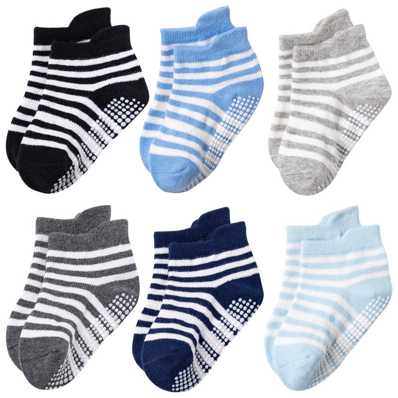 Six pairs of striped toddler grip socks in blue, navy, black and gray