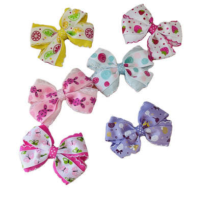 Six printed bow hair clips in assorted pastel colors